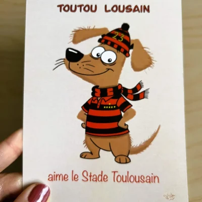 carte postale d'un chien humoristique habillé avec maillot du stade toulousain . le chien s'appelle toutou lousain
